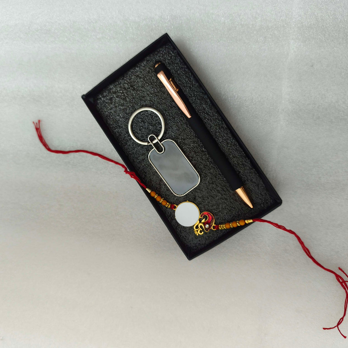 Personalized Rakhi Gift Set for Brother – Custom Photo Rakhi with Engraved Metallic Pen & Keychain Combo