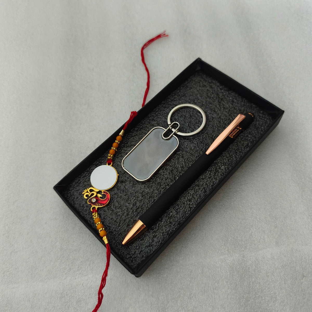 Personalized Rakhi Gift Set for Brother – Custom Photo Rakhi with Engraved Metallic Pen & Keychain Combo